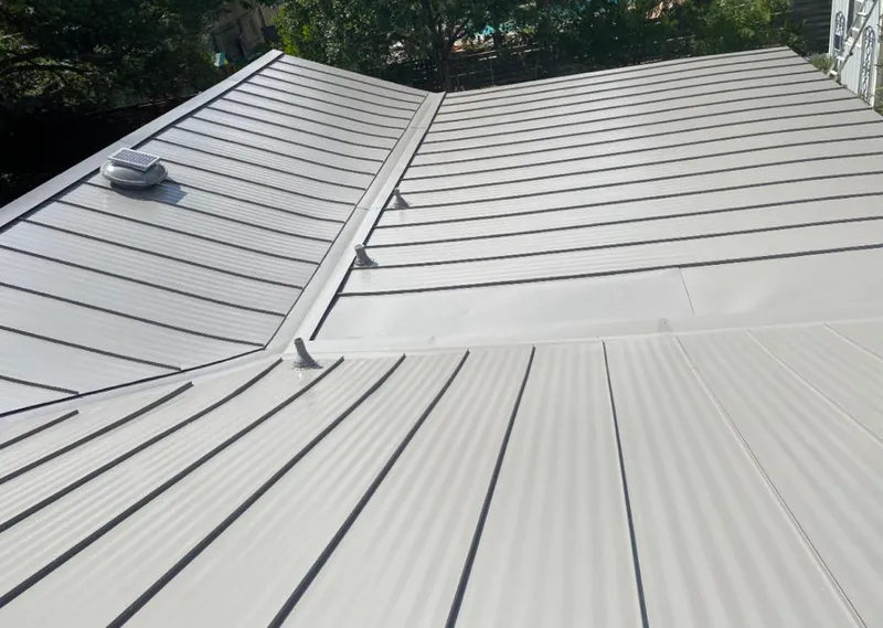Solar attic fan installed on a metal roof for Roof Ventilation in Kittery